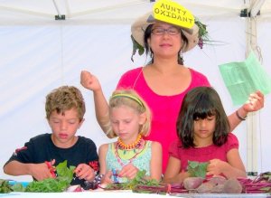 This is me, taking a cleansing breath, during a Little Locavores cooking demo at the Mpls Farmers Market. My sous-chefs were so ably snipping away at greens with their craft scissors that I decided to meditate for a bit. 